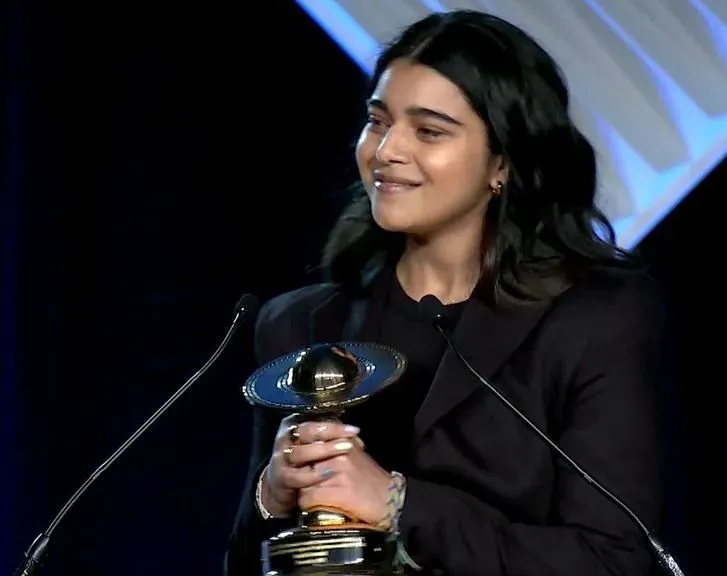 Iman receiving award