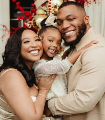 Leeyah with her husband and daughter